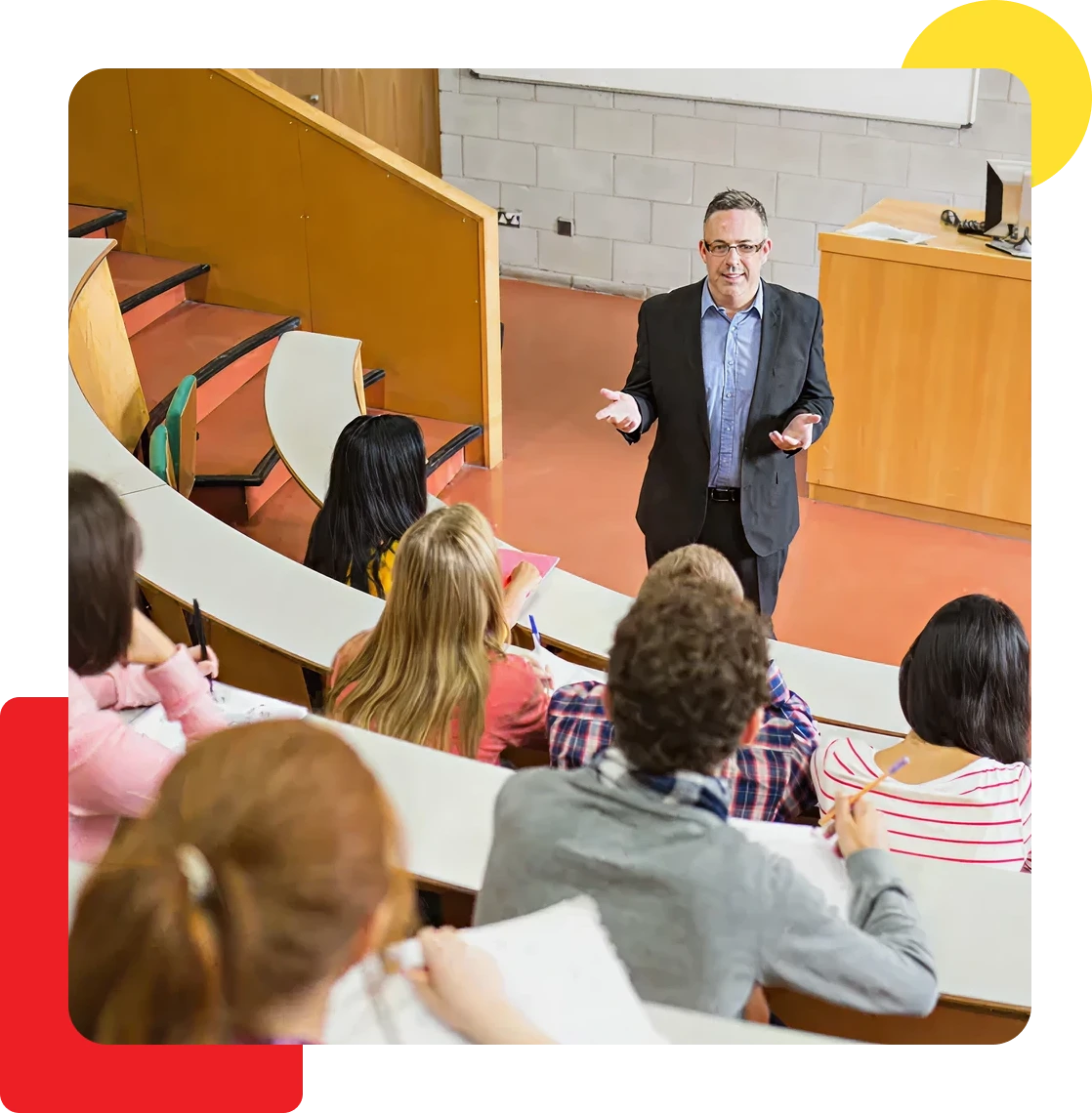 Professor lecturing to attentive university students.